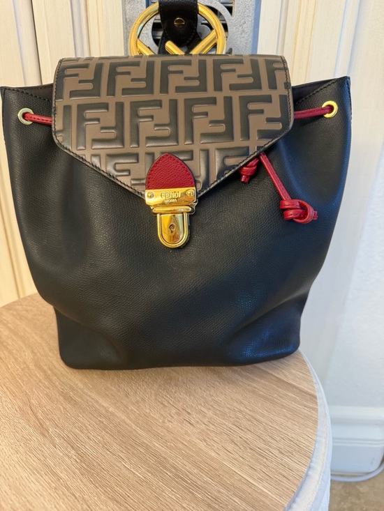 Fendi Handbags - Fendi Black Leather Backpack with Brown Monogram Flap and Red Accents